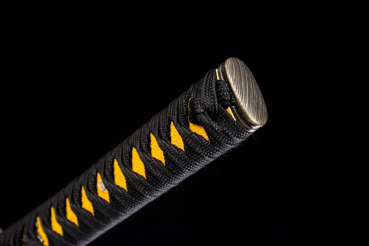 The Gilded Coil Katana with the gold serpentine artwork on the lacquer