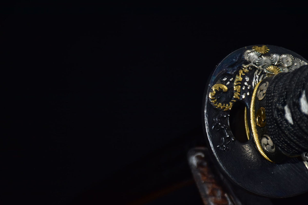Reverse view of gold and silver finished copper tsuba