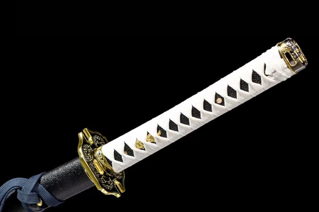 Close-up of the Yamato Katana’s white handle, guard, and gold-accented fittings