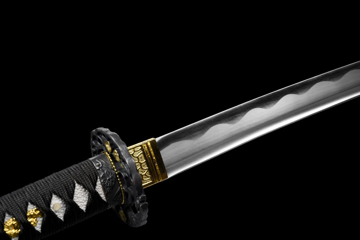 Close-up of Kuro Katana polished blade with visible wave-like line near the guard
