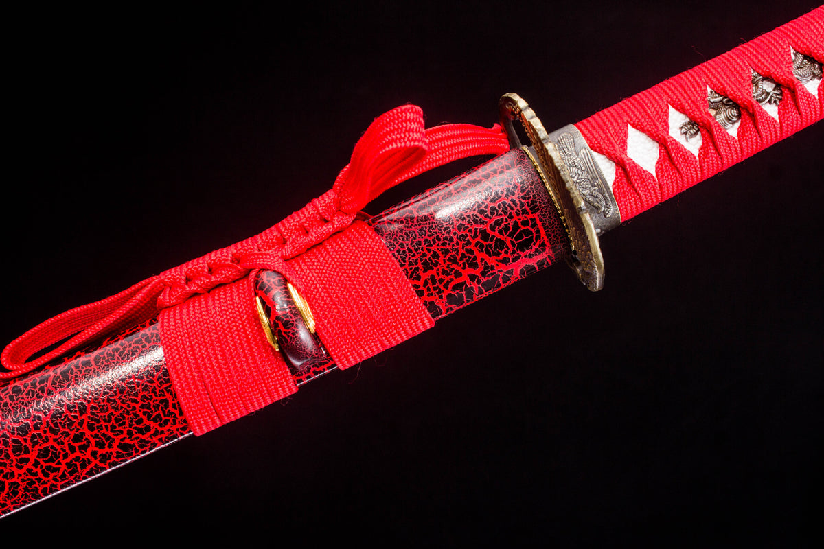 Close-up detail of the Crimson Crackle Katana, including the gold-toned blade collar and fittings