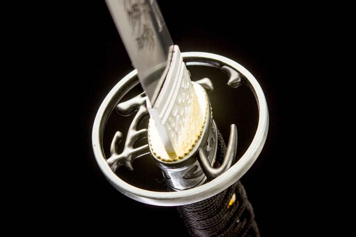 Gilded Dragon Katana displayed unsheathed with a polished blade and black decorated saya