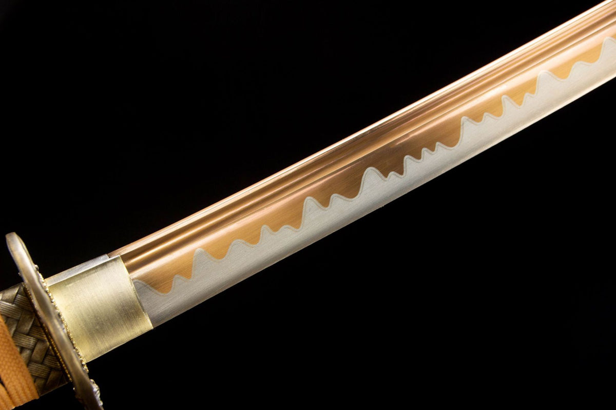 Detail view of the Golden Pearl Katana, showing the pale engraved blade and gold handle