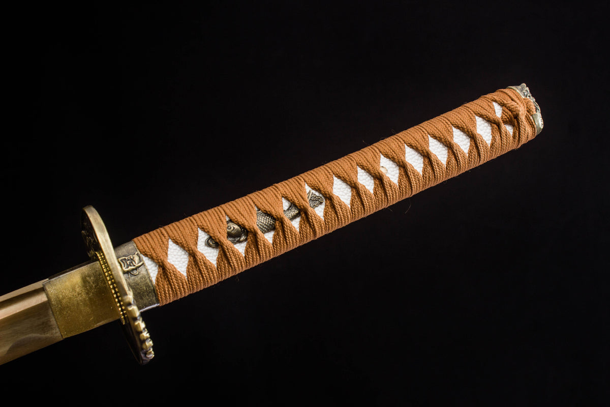 Close-up detail of the Sakura in Gold Katana, including the sakura decoration on the lacquer