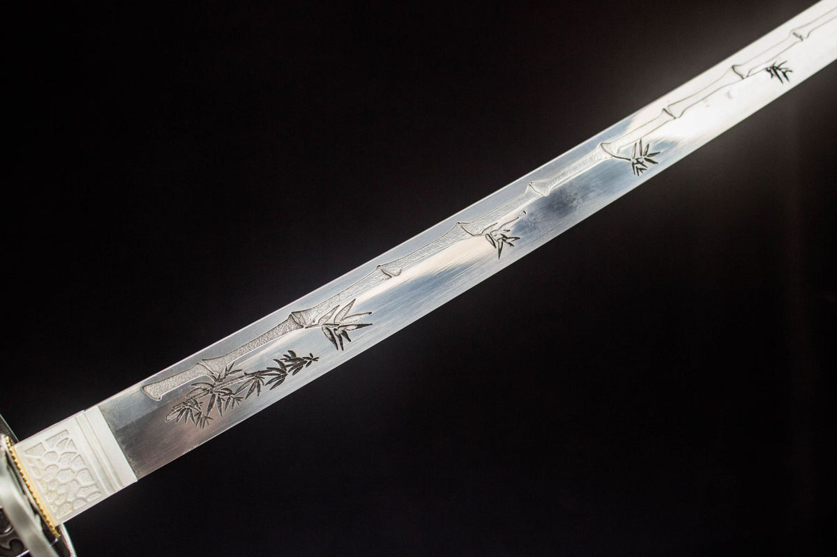 Detail view of the Gilded Dragon Katana, showing the polished blade and black decorated saya