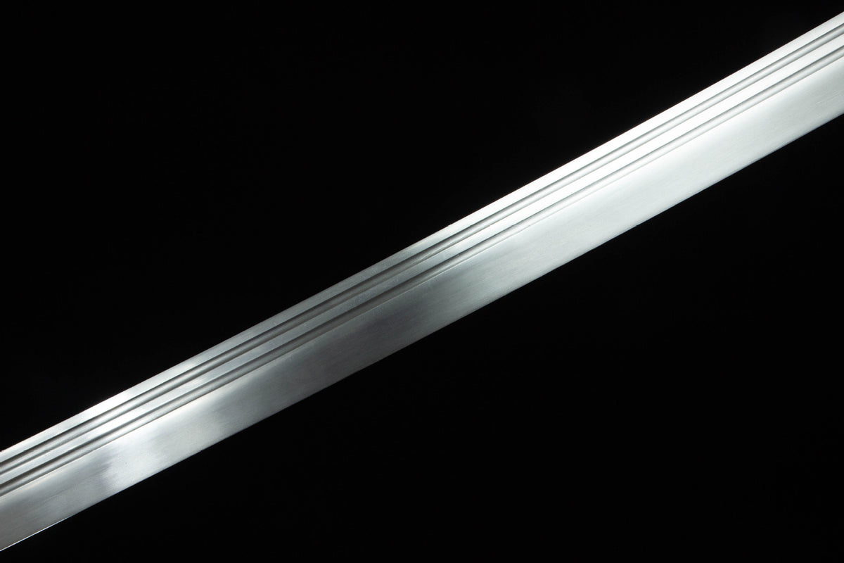 The Twin Rivers Katana with the warm patterned mounting and fittings