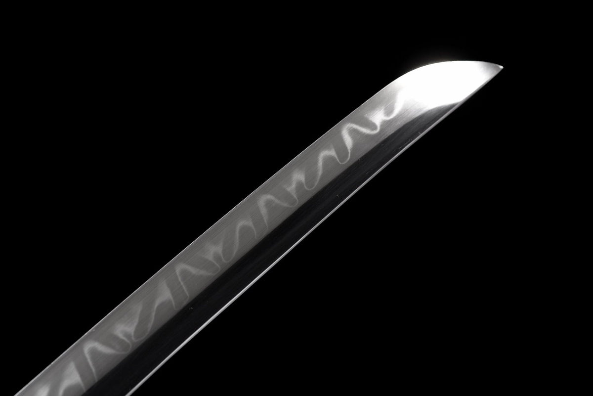 Close view of the curved blade tip and visible wave-like surface line