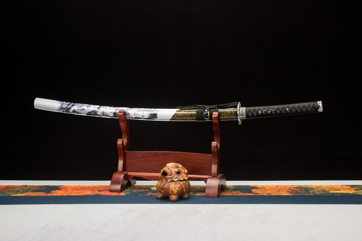 Moonlit Dragon Katana displayed unsheathed with a pale blade and illustrated black and white saya
