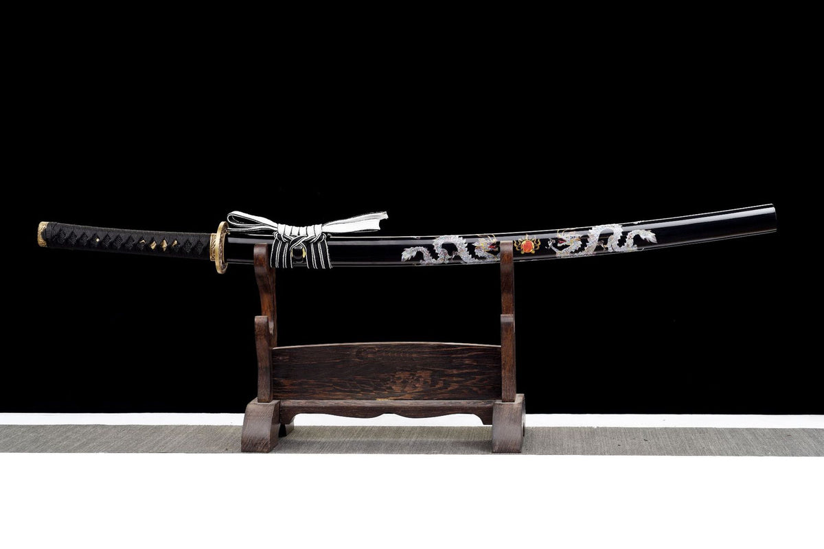 Twin Dragons Katana displayed unsheathed above a black saya with twin silver dragon artwork