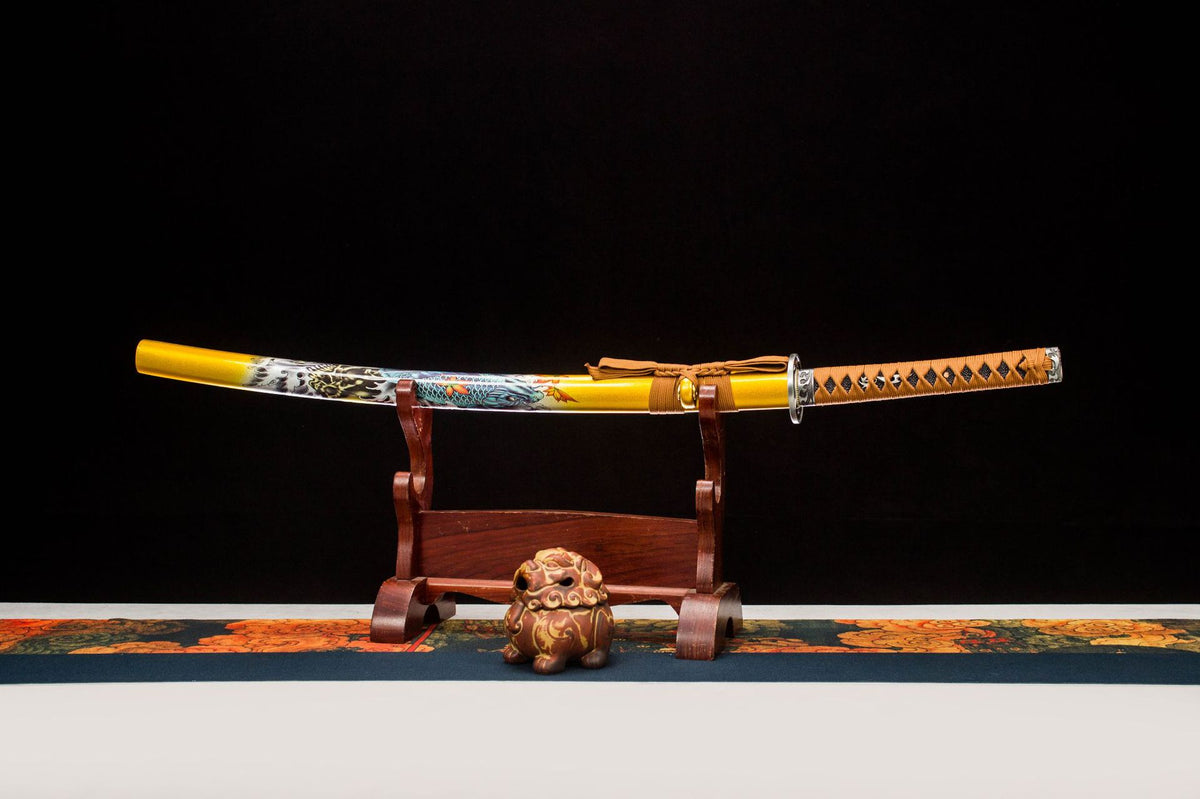 Aureate Koi Katana displayed with a yellow koi-illustrated saya and orange handle wrap