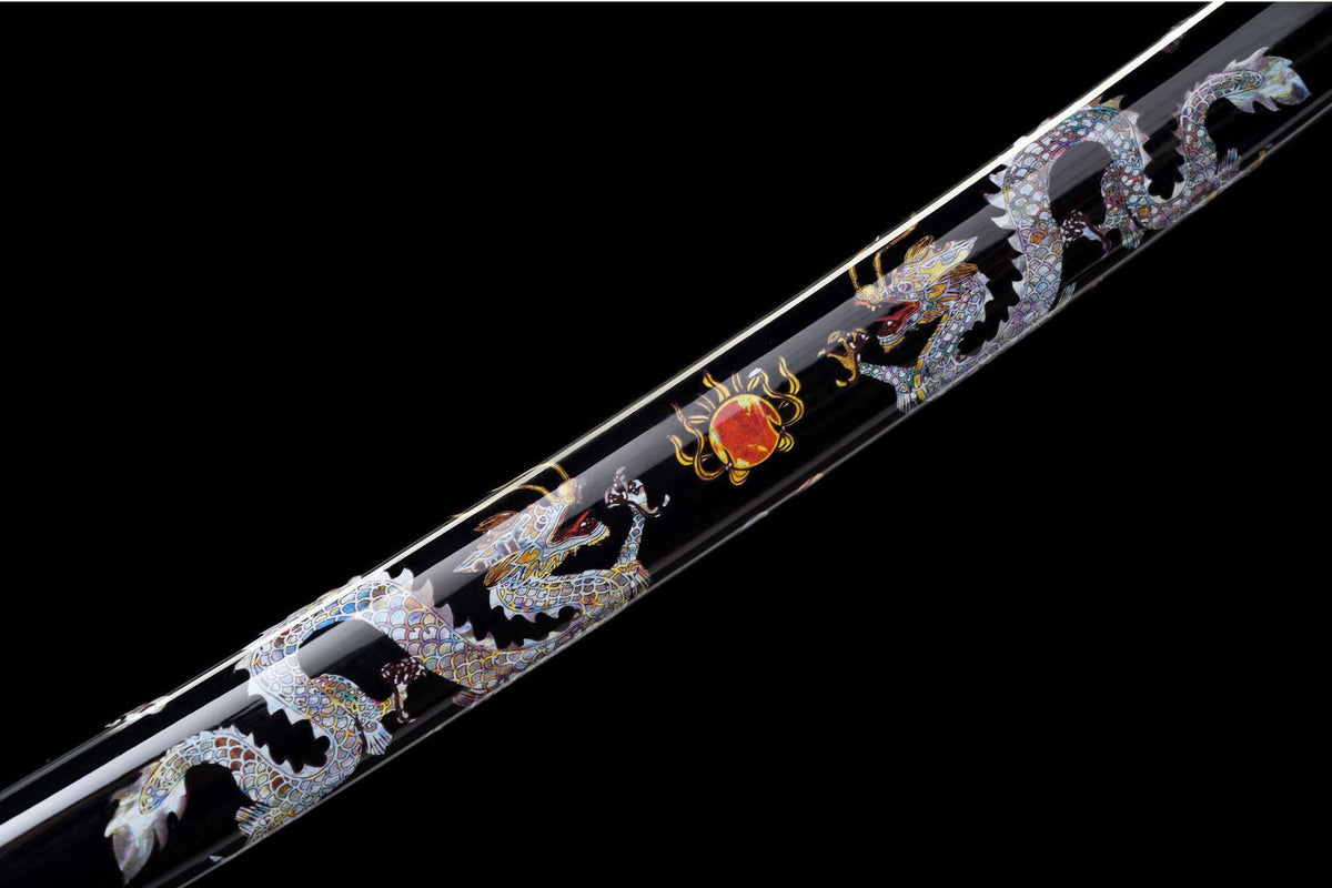 Detail view of the Twin Dragons Katana, showing the mirror-polished blade and black saya
