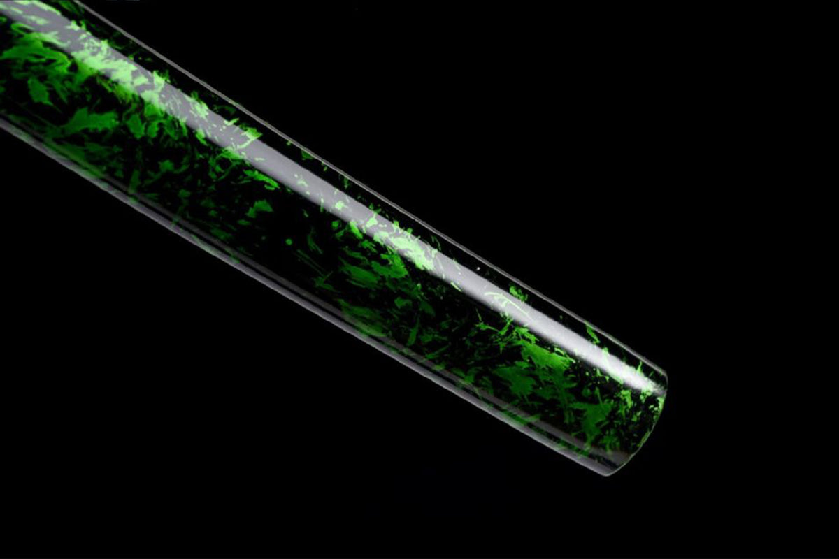 Close view of dark saya with green foliage pattern