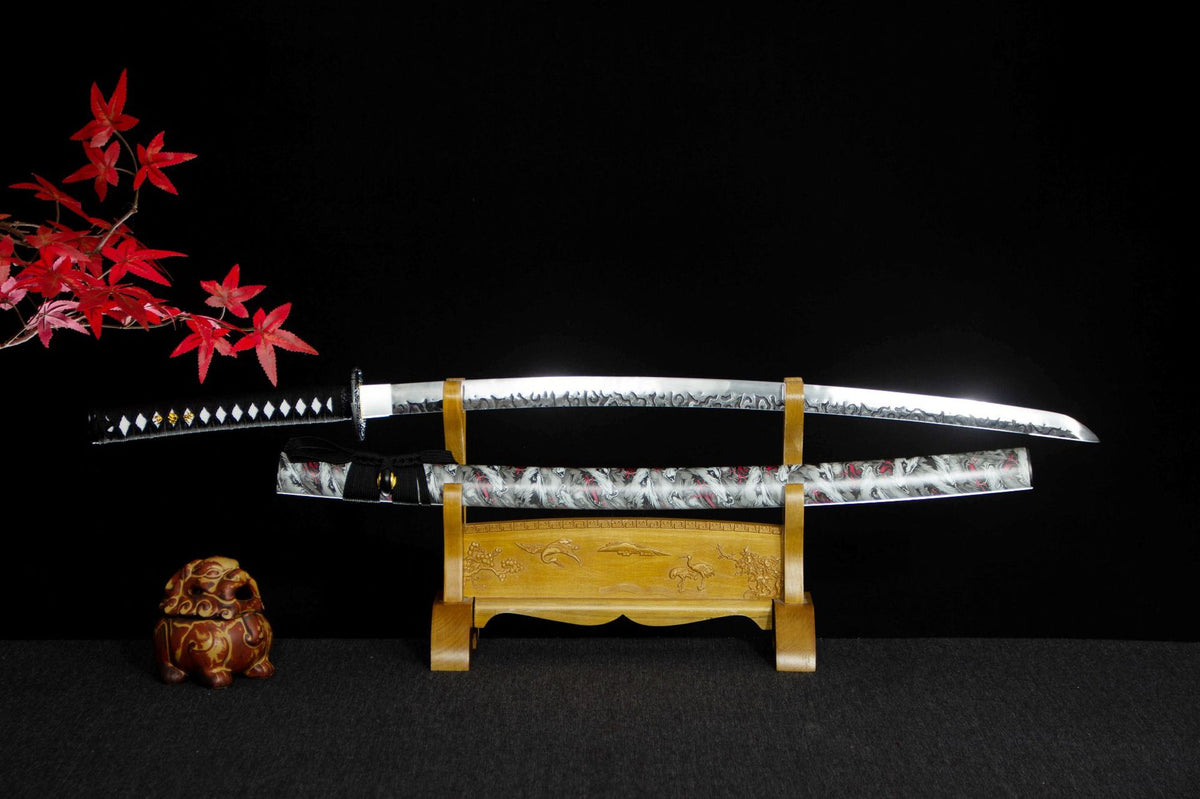 Autumn Mist Katana with a black handle, pale patterned saya, and red maple accents