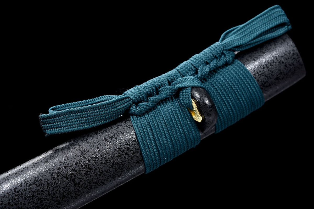 Close-up of the Kyoshiro Katana’s teal handle wrap, sageo knot, and dark blade surface