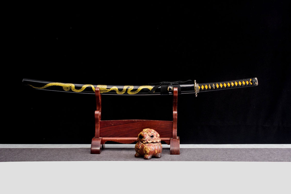 Gilded Coil Katana displayed sheathed with a black saya and long gold coil design