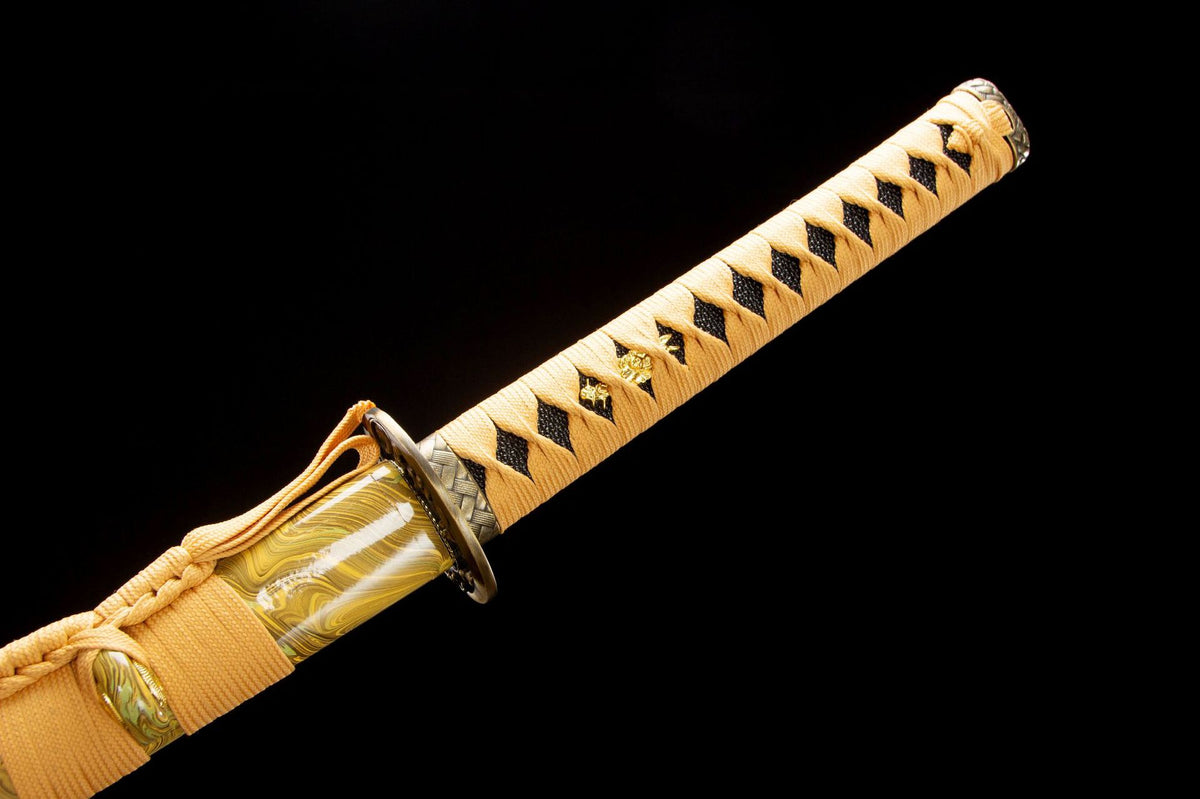 Close-up of the Golden Pearl Katana’s gold handle wrap, marbled saya, and metal fittings