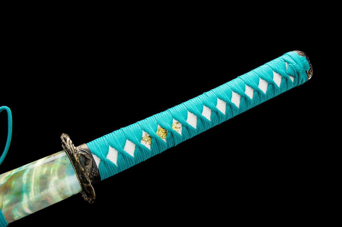 Close-up of the Turquoise Pearl Katana’s turquoise handle wrap, white grip panels, and fittings