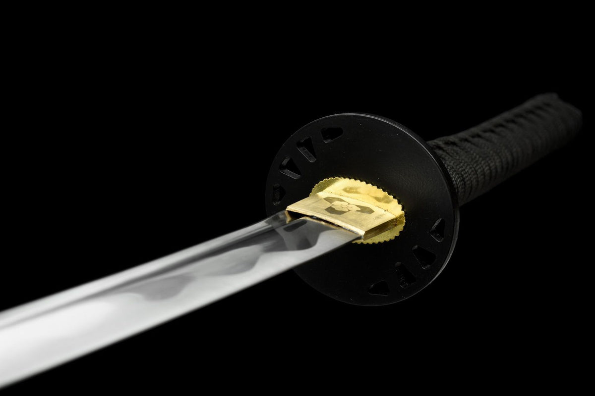 Gold-toned habaki and round openwork tsuba on the Kokuryu Katana