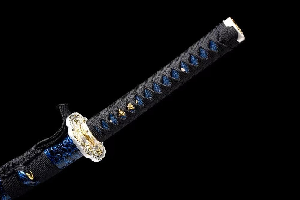 Black tsuka-ito over blue textured panels with gold-tone ornaments