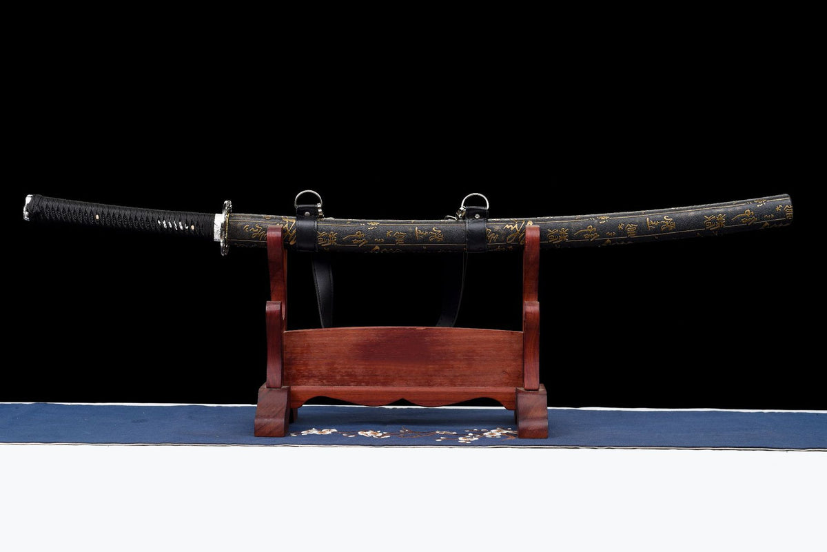 Calligraphy Katana sheathed in its black lacquered gold-lettered saya