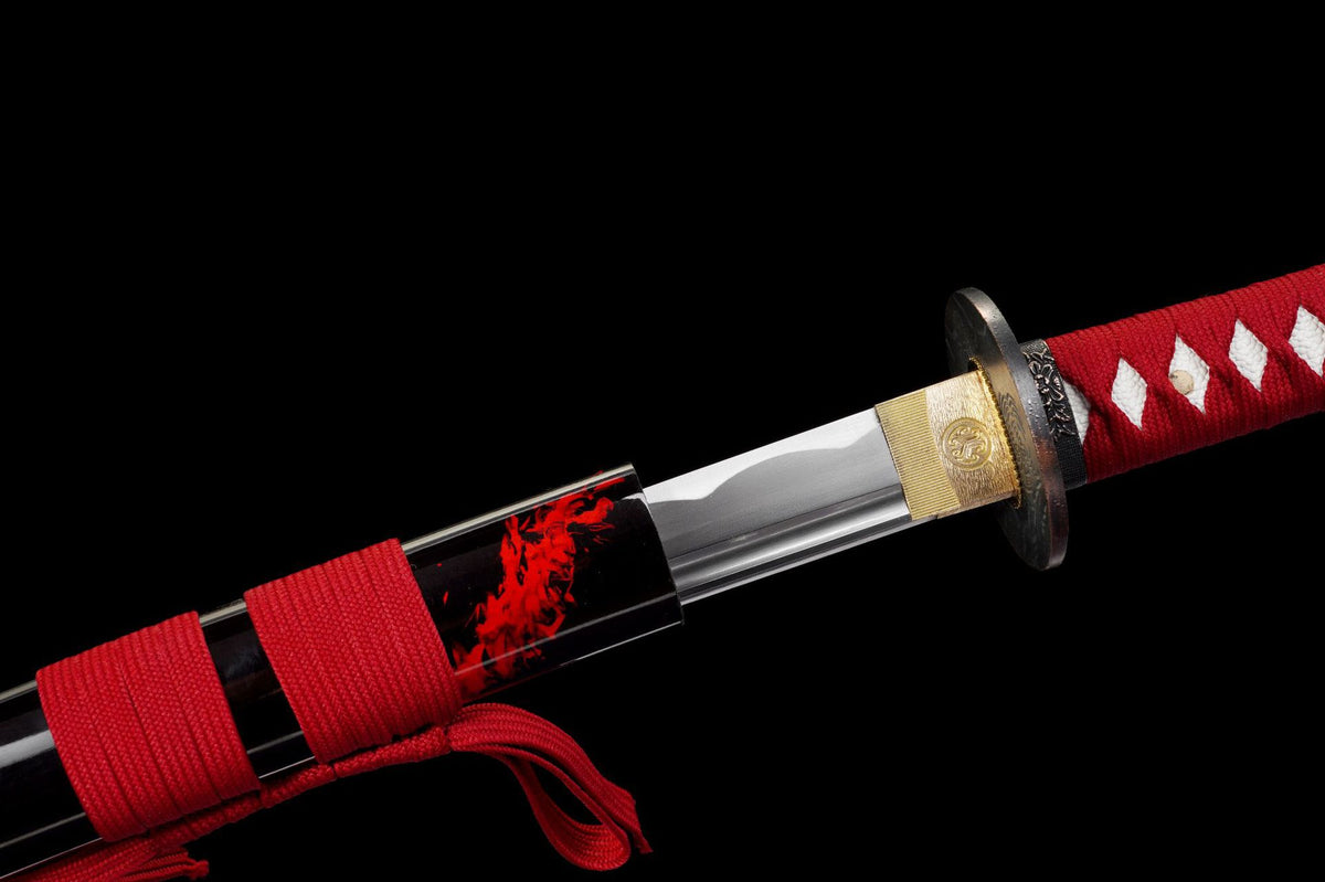 Habaki, classical tsuba, and red handle wrap in close detail