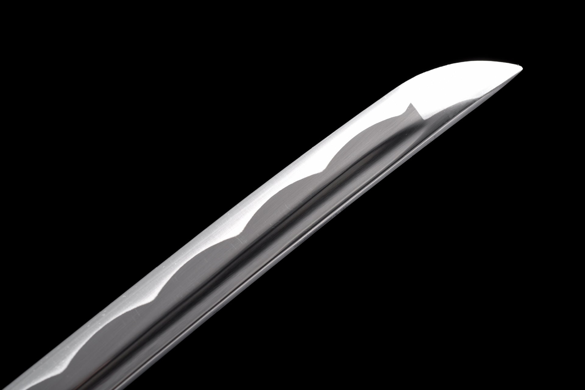 Kissaki tip of the grooved 1045 steel katana blade