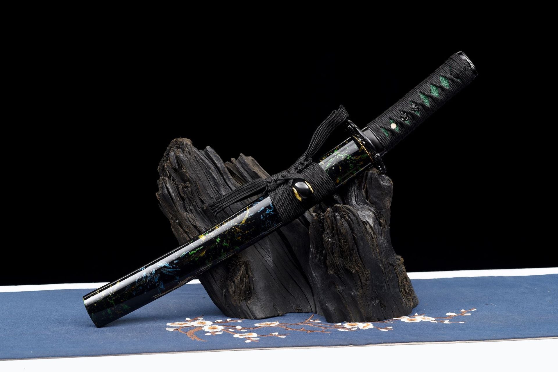 Black lacquered wooden saya with blue green and gold accent detailing