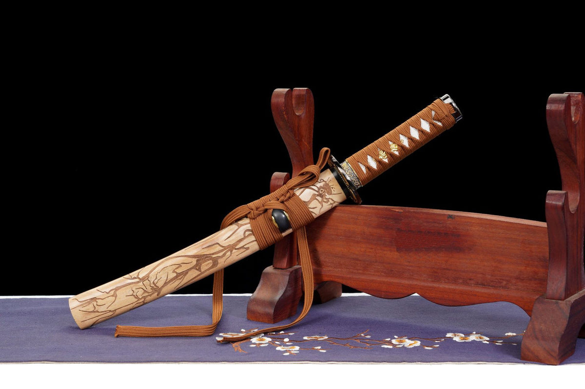Nightingale wakizashi showing the carved saya and brown wrapped handle