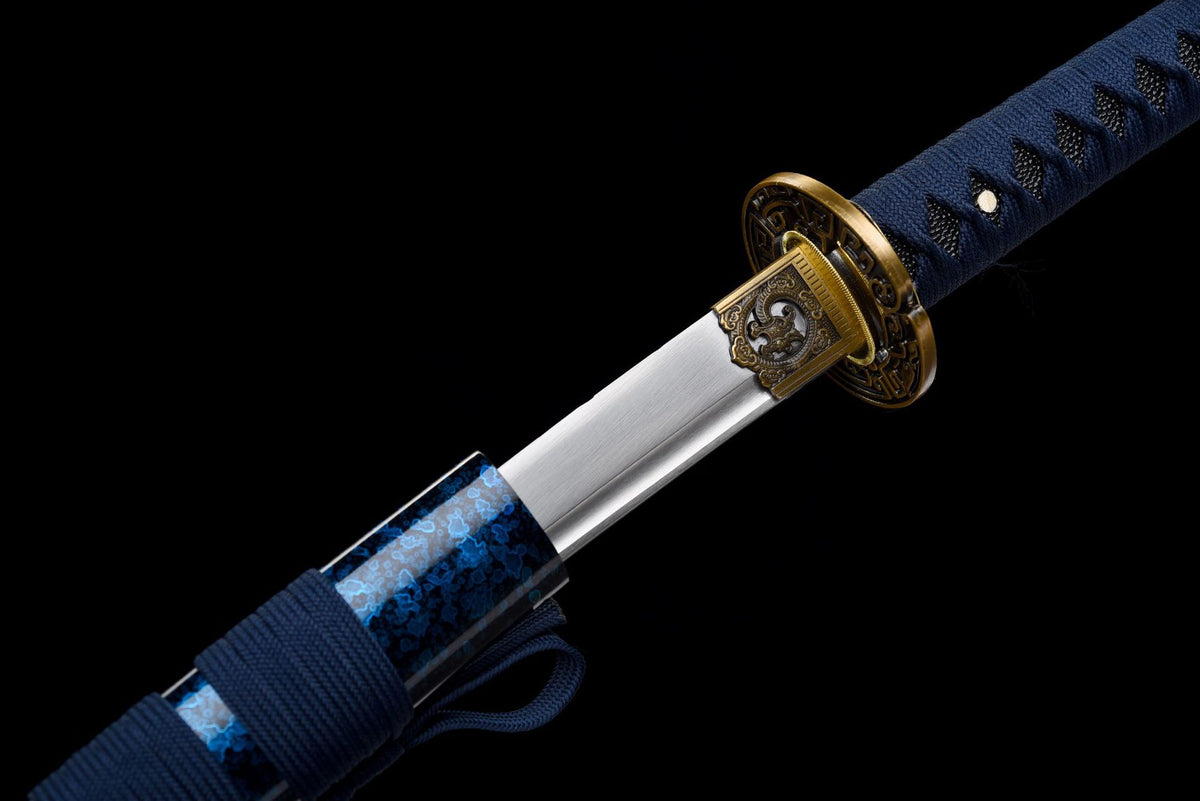 Polished blade beside the blue floral-pattern solid-wood saya