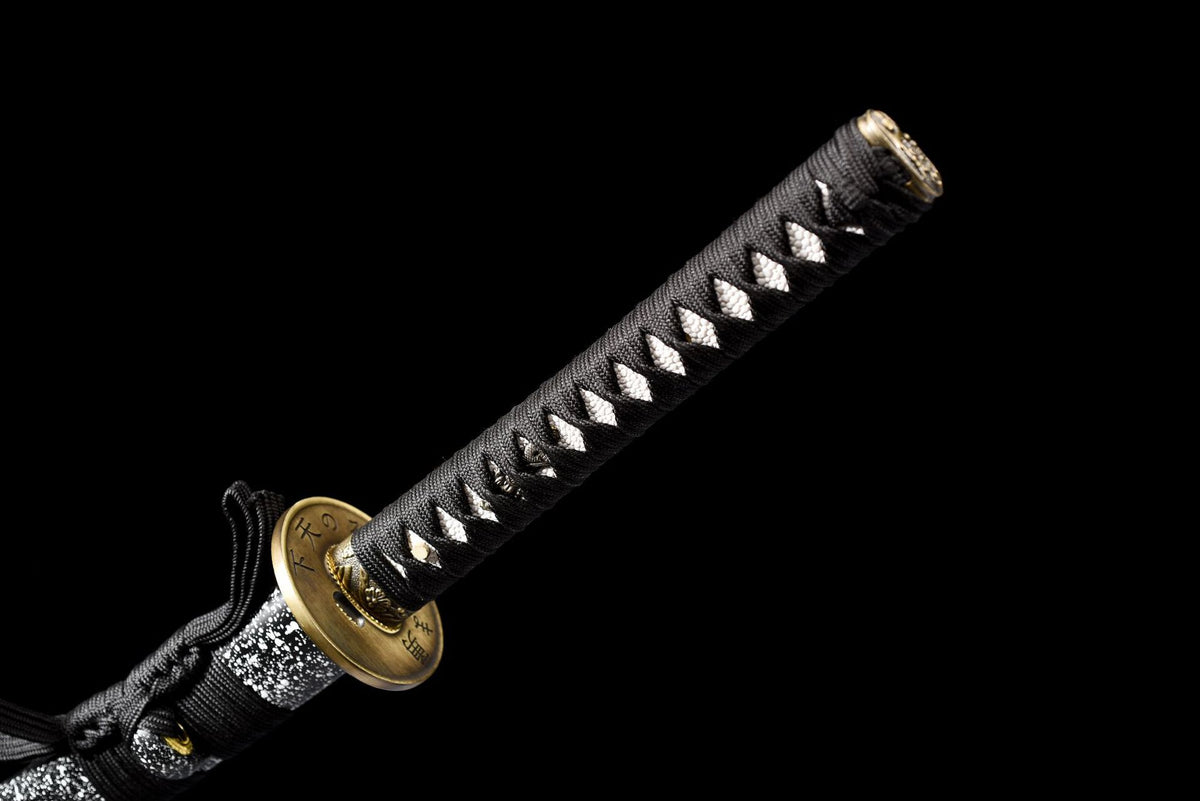Black cord-wrapped tsuka with white panels and antique-gold-tone fittings
