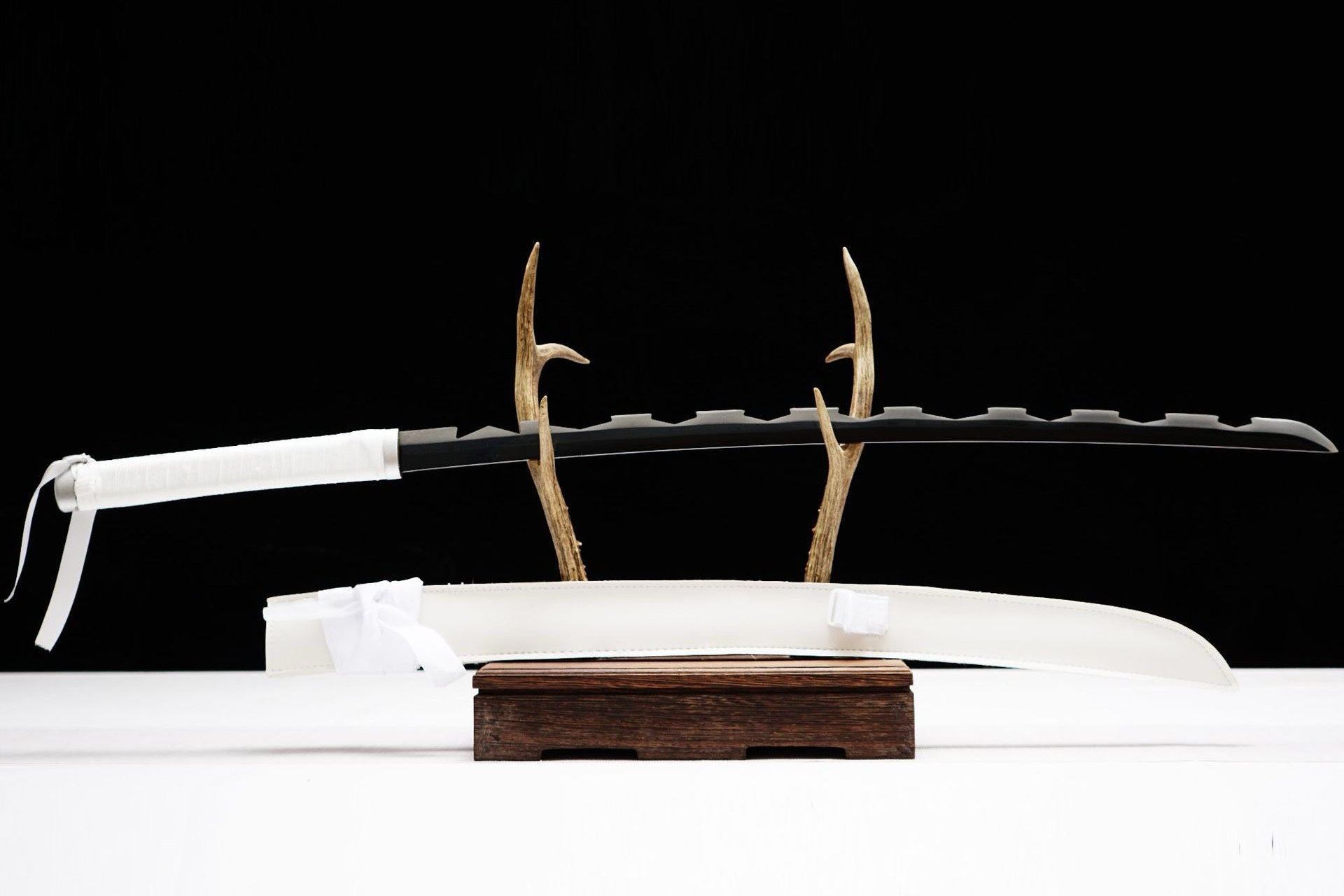 Full view of Inosuke Hashibira Katana with dark serrated-profile blade and white scabbard