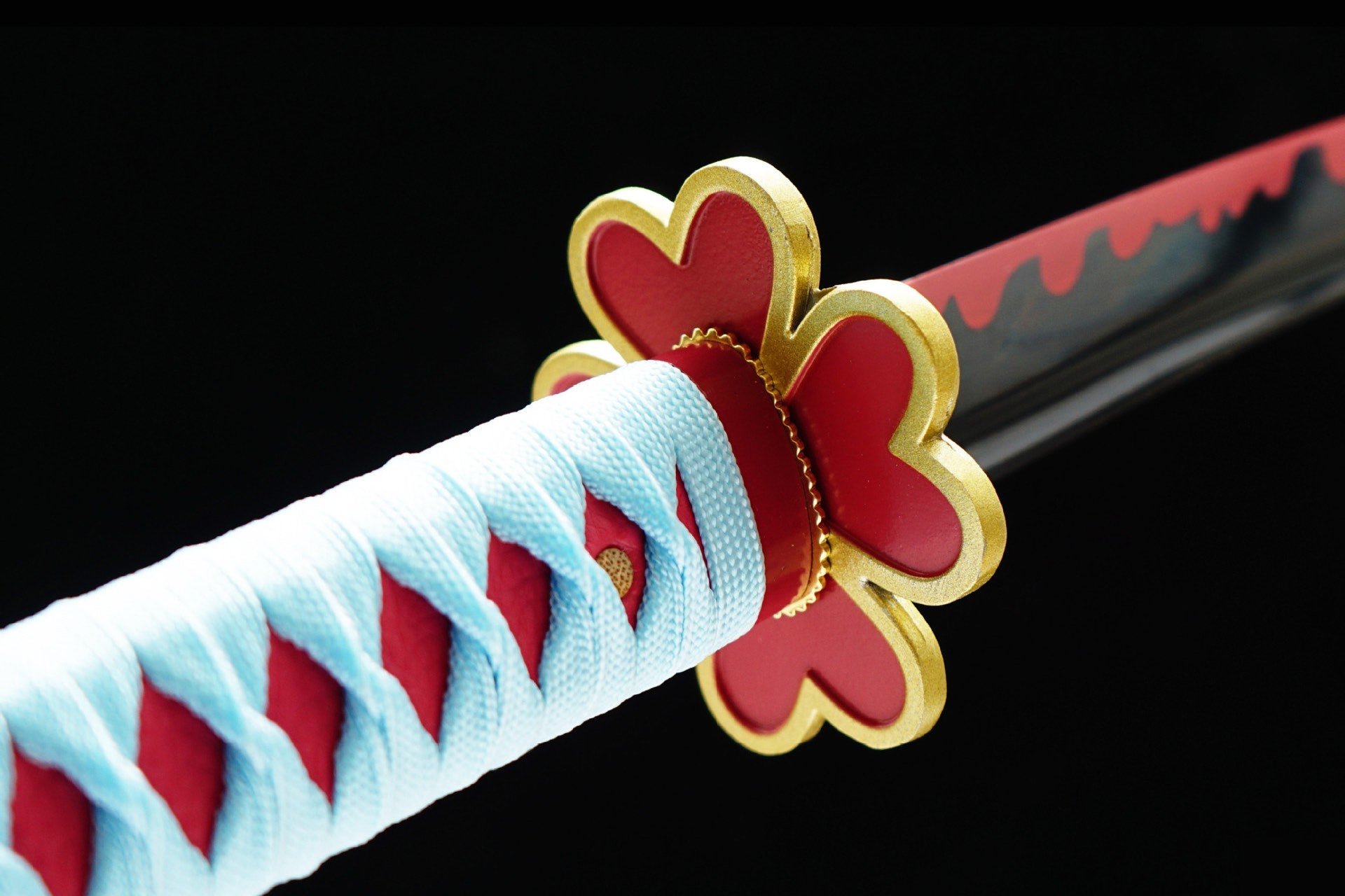 Red-and-gold heart-shaped Mitsuri Nichirin sword guard with pale blue handle wrap