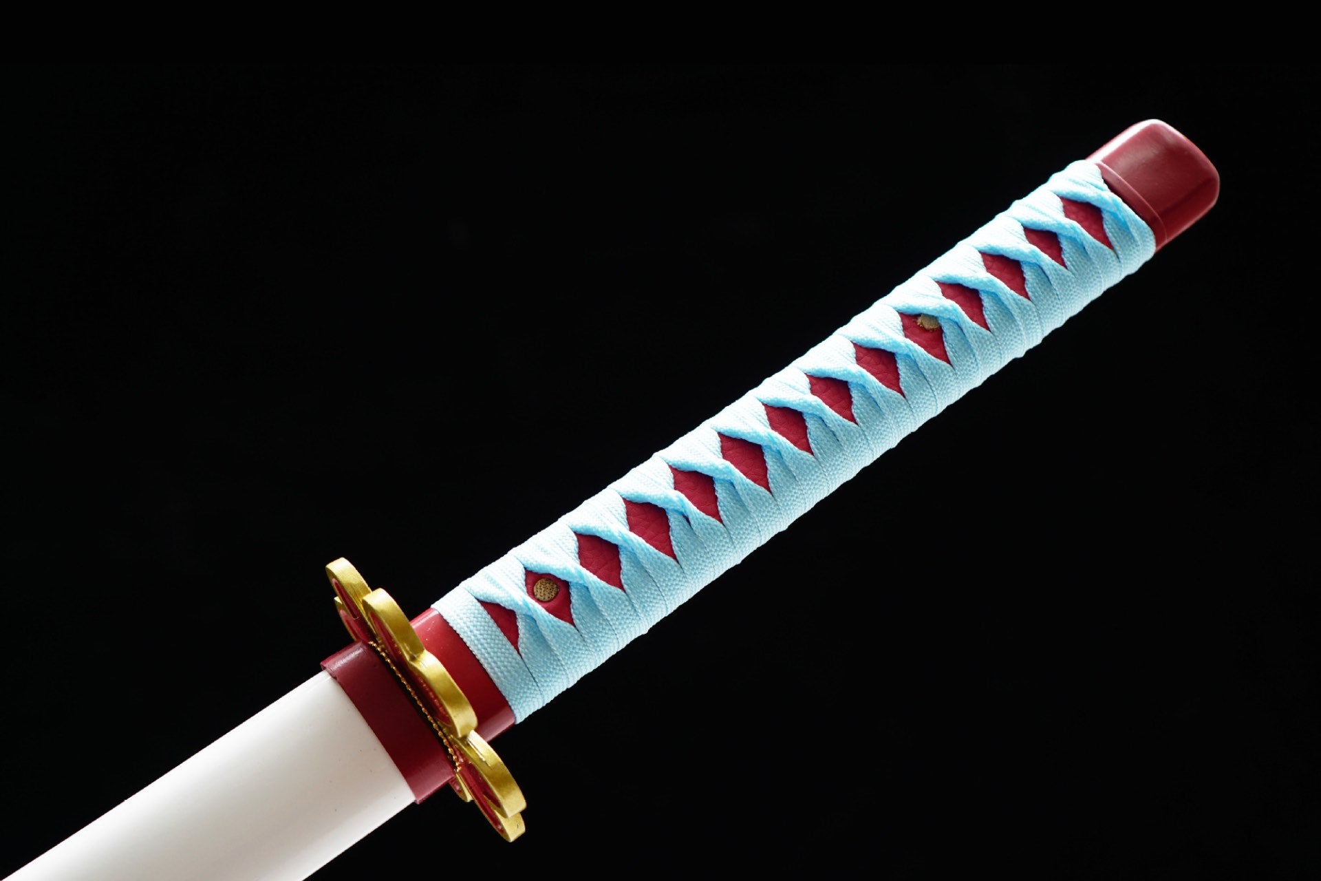 Pale blue handle wrap with pink underlayer and red pommel
