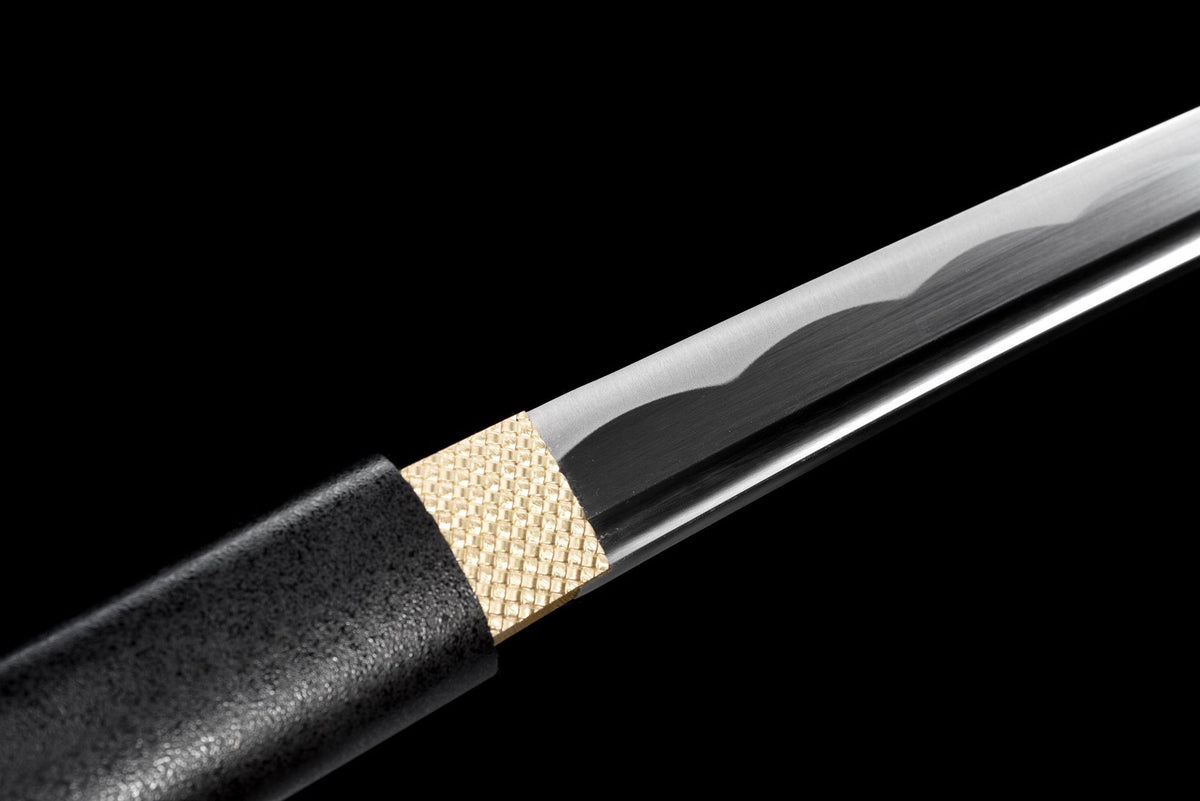 Gold-toned textured habaki and black lacquered wooden tsuka