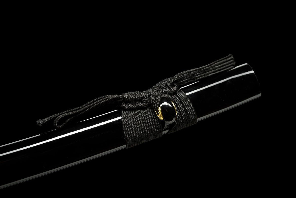 Black sageo tied around the lacquered wooden saya