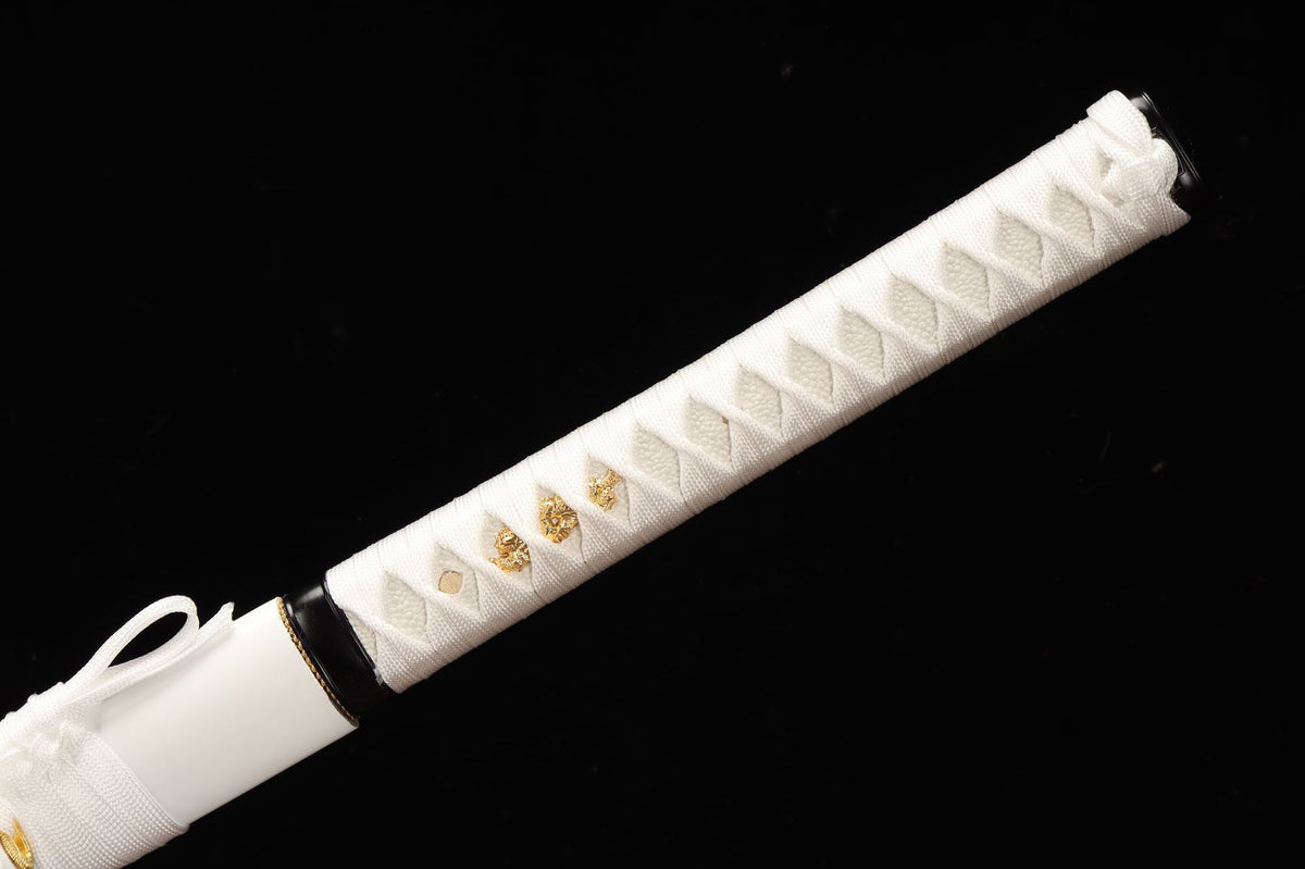 White wrapped tsuka with gold-toned figural ornaments