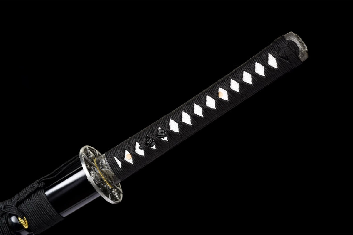 Black tsuka-ito over white samegawa with skull ornaments