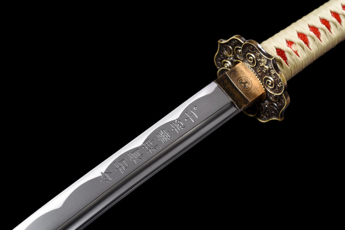 Engraved blade, gold-toned habaki, and antiqued floral tsuba on Leopard Katana