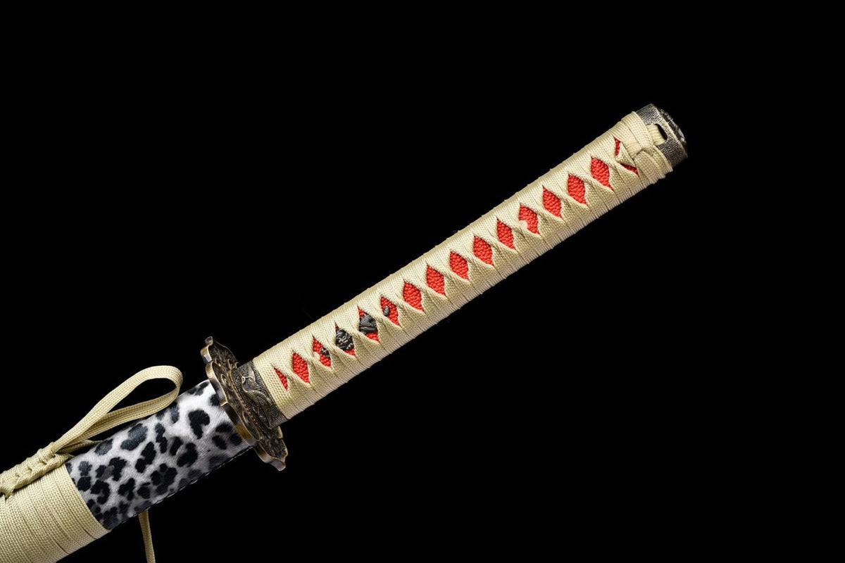 Ivory tsuka-ito with red diamond-shaped openings
