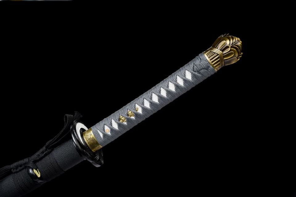 Pale gray tsuka-ito over white panels with gold-tone ornaments