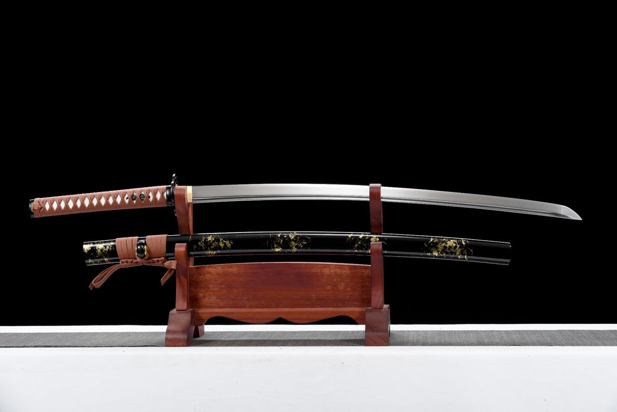 Unsheathed Russet Goldleaf Katana with 1045 carbon steel blade and black lacquered saya