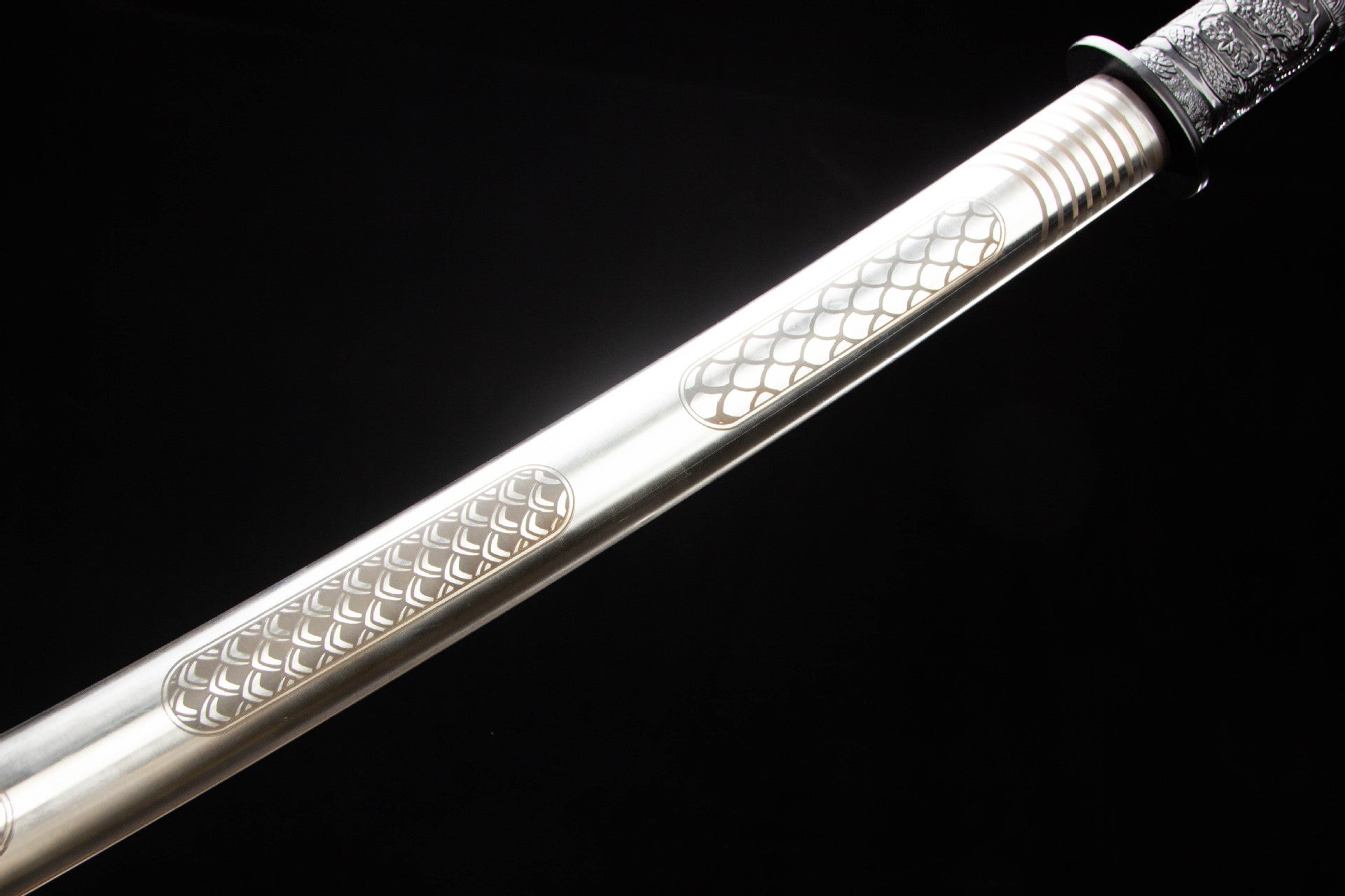 Polished stainless steel saya with engraved scale-pattern panels