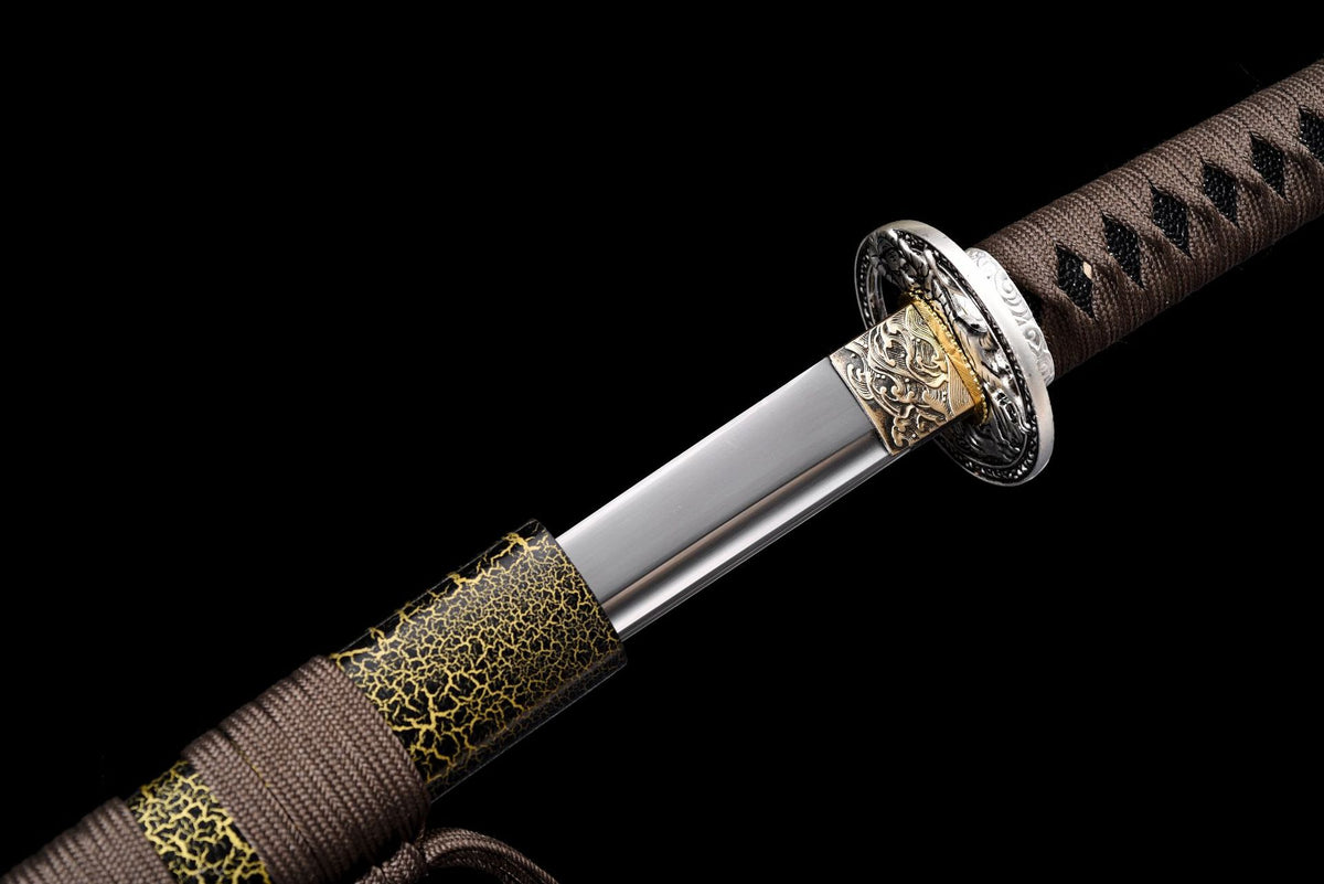 Blade entering the crackle-lacquered wood saya