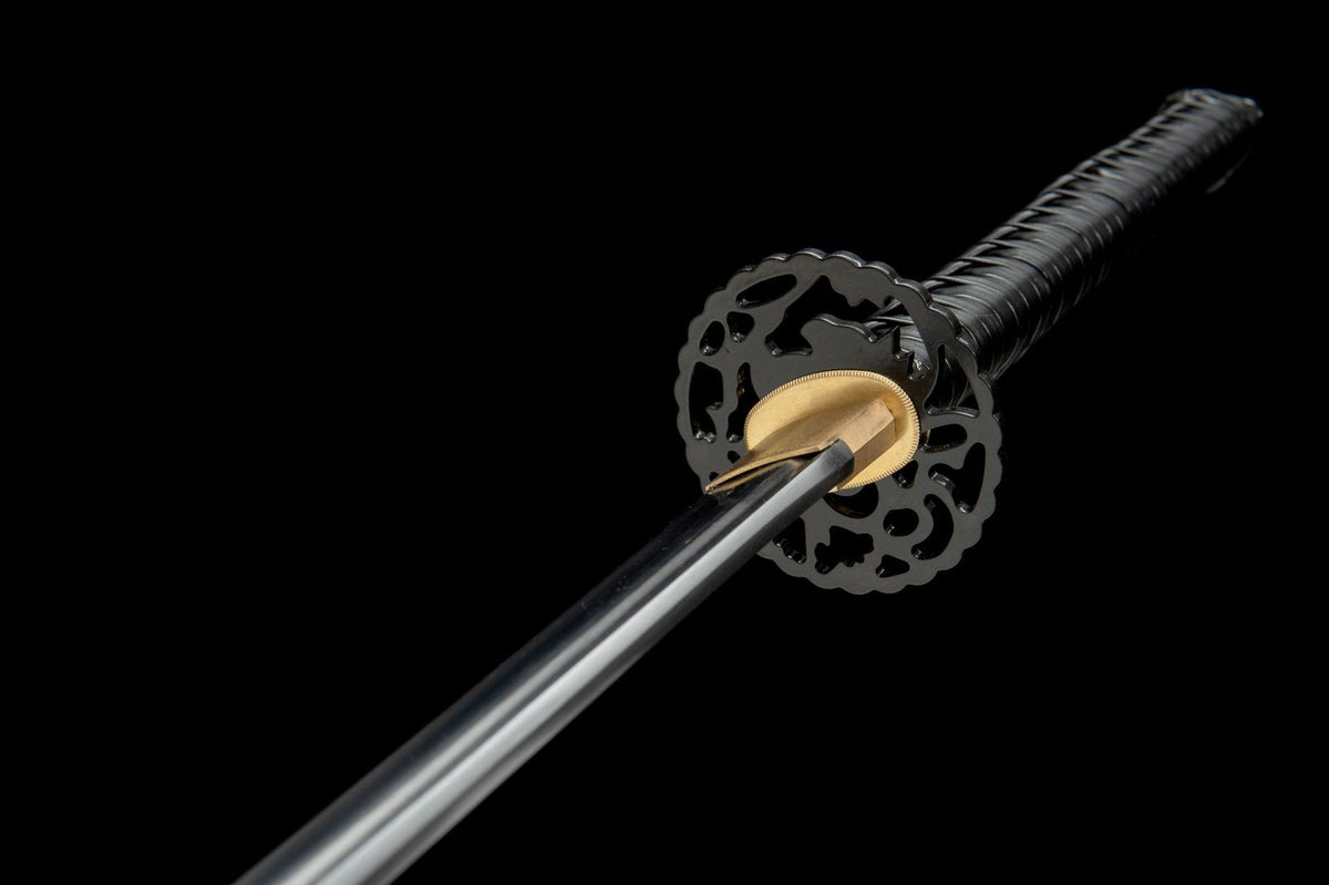 Copper seppa, openwork iron tsuba, and black tsuka-ito detail
