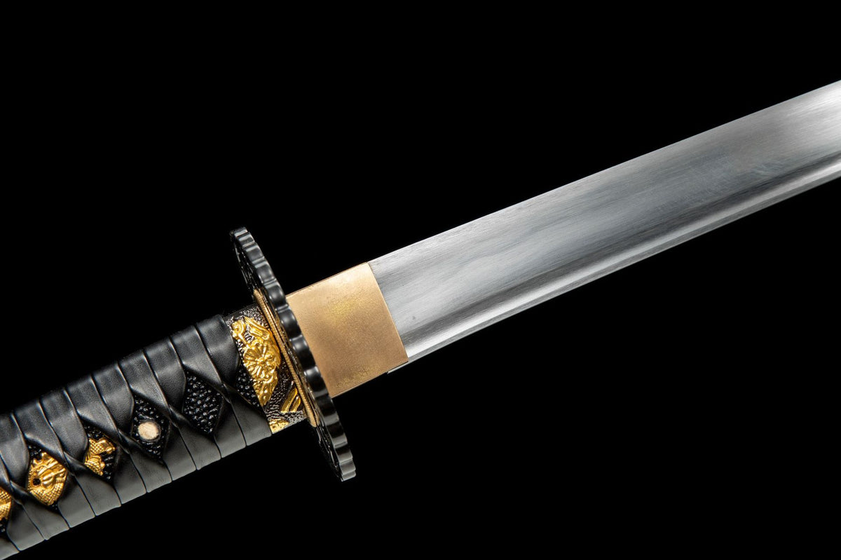 Satin-finished blade and copper habaki close-up