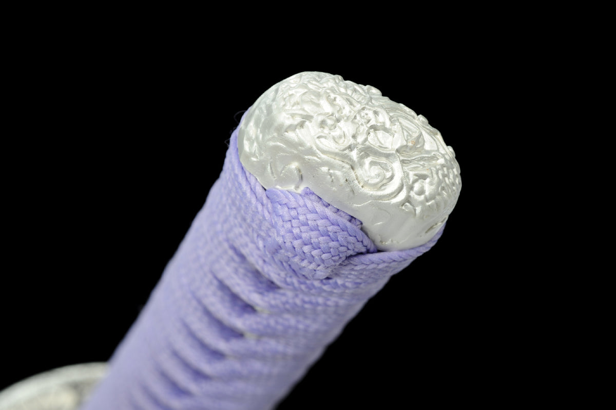 White relief-finished kashira on the lavender-wrapped tsuka