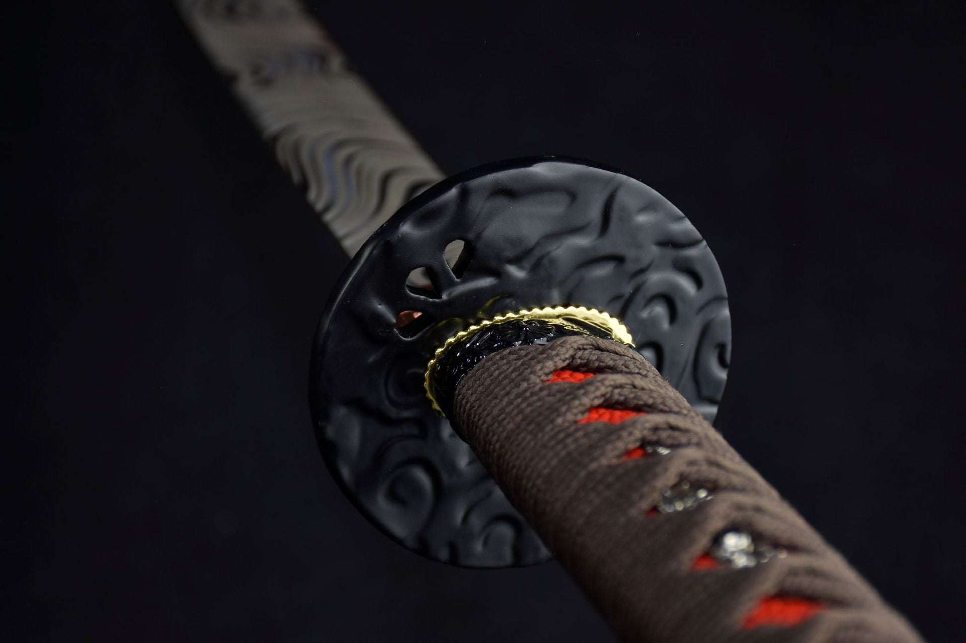 A black iron tsuba on a samurai sword