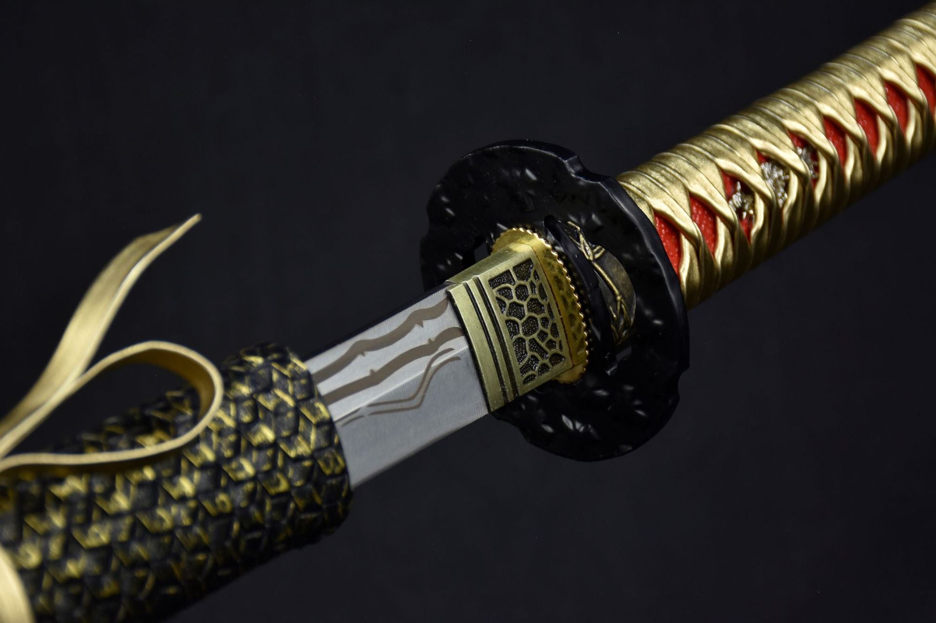 A black round tsuba with elegant craftsmanship