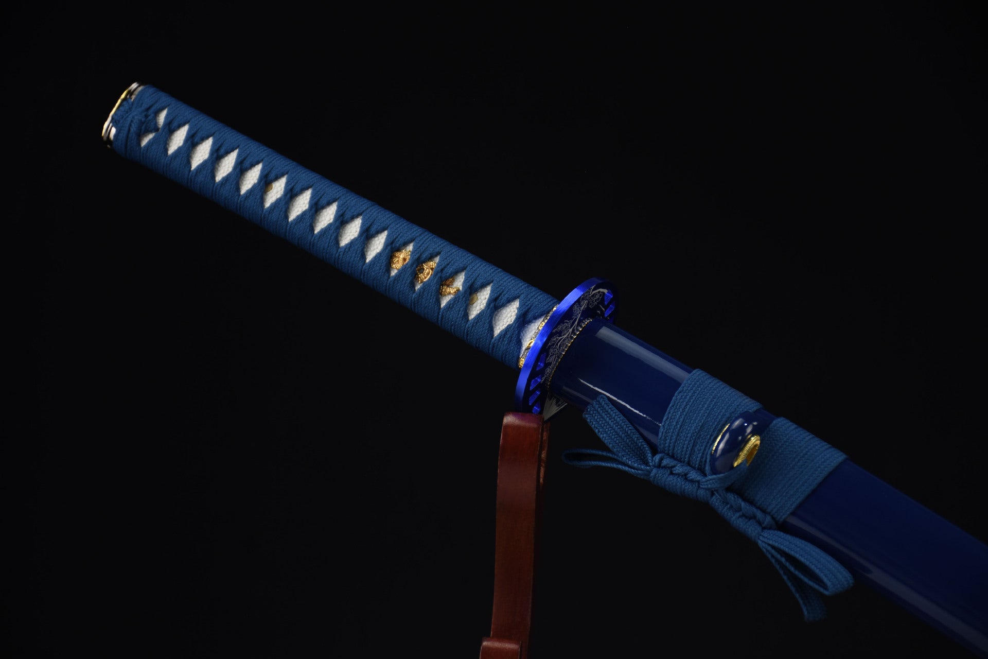 A close-up of the blue katana handle highlighting its detailed craftsmanship.