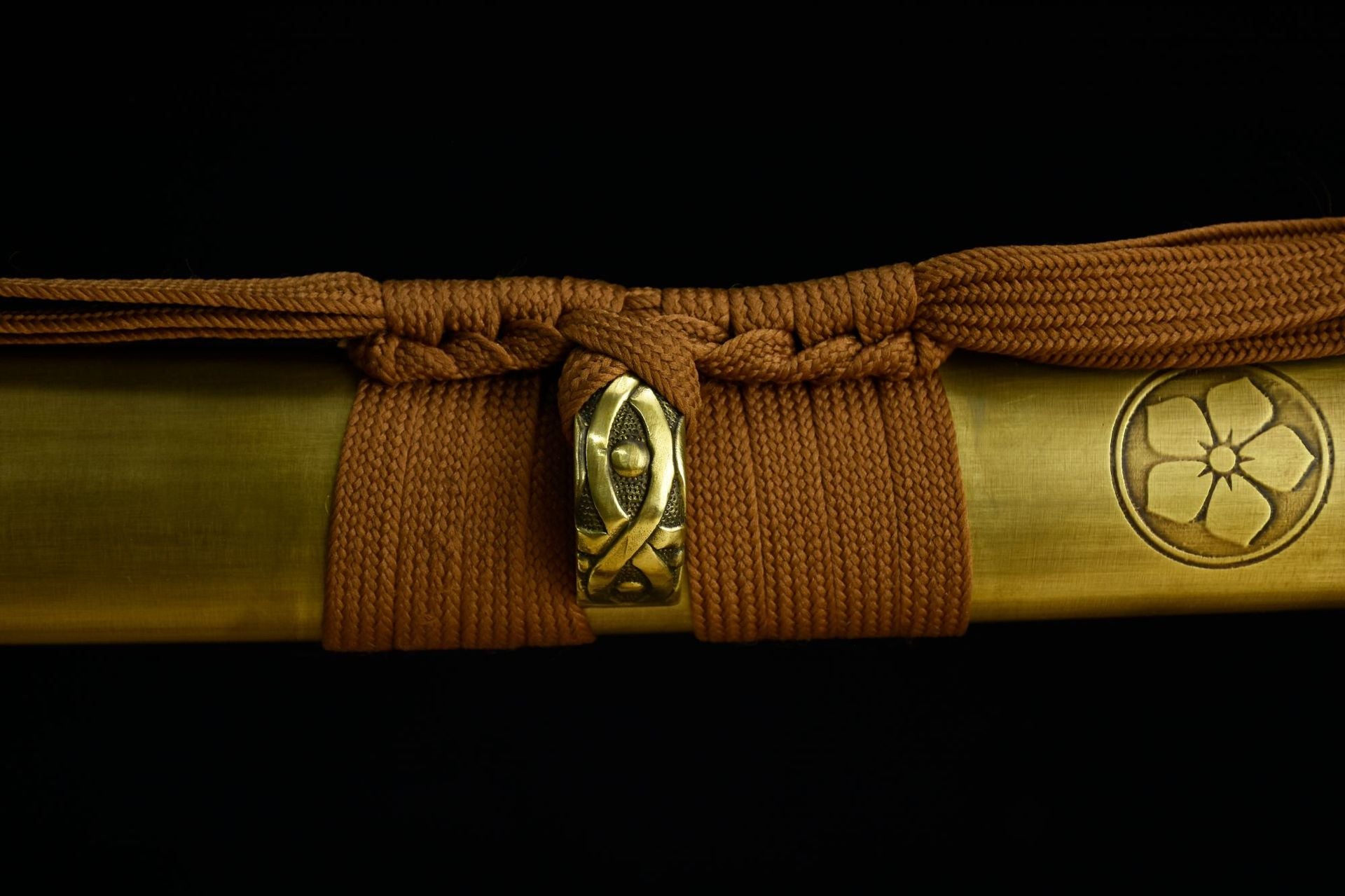 Brown sageo tightly secured to the scabbard in a close-up view.